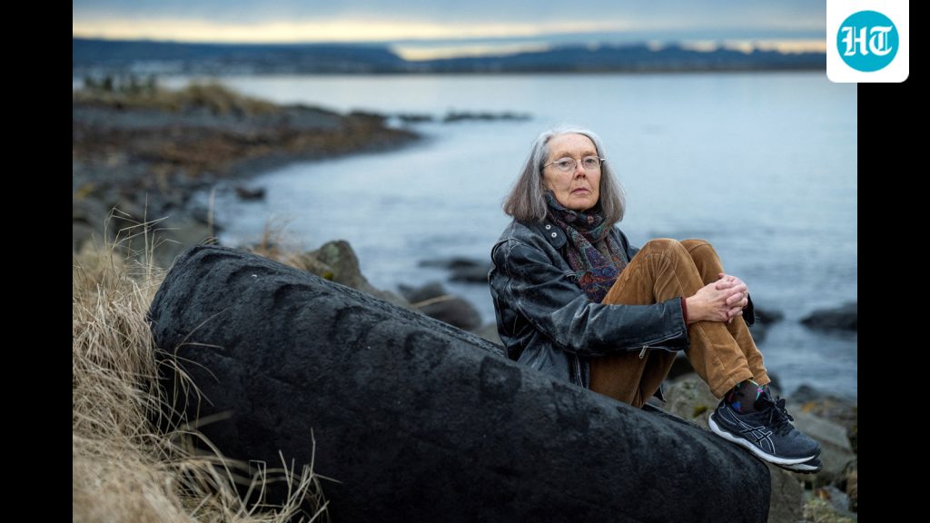 Anne Carson, winner of the Nobel Prize for Literature sits outside her home in Reykavik